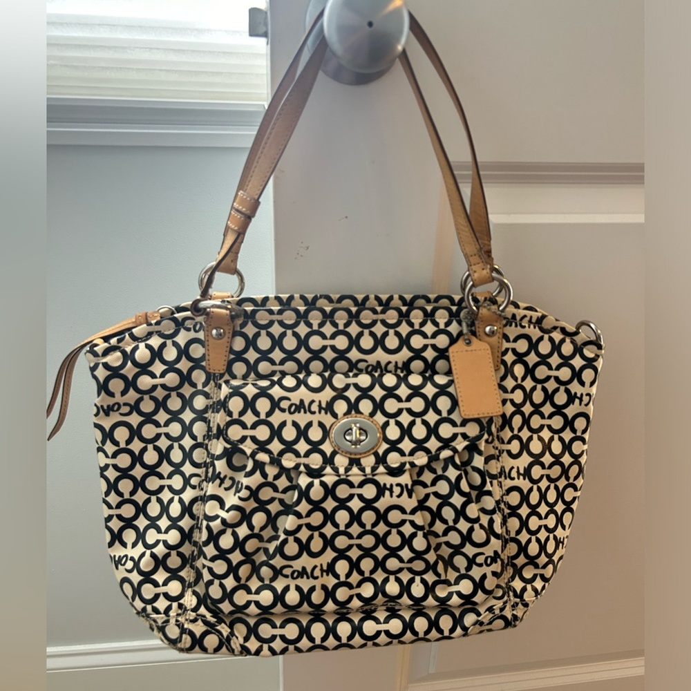 Good condition Coach tote with blue lining. A few marks inside and stiff zipper